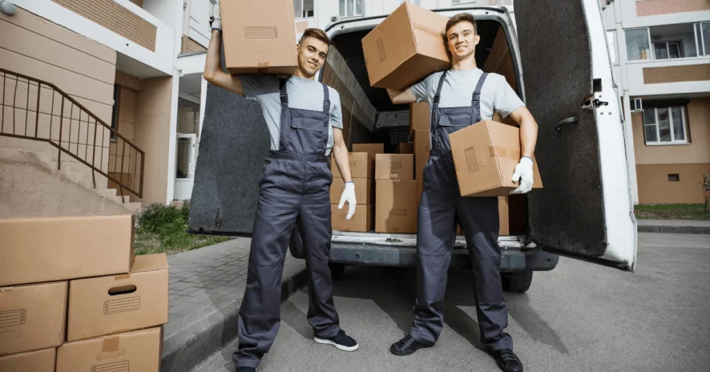 professional movers team safely moving furniture and household items