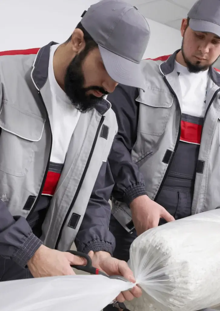 apartment moving team safely packing and relocating apartment furniture